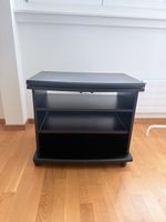 ⁠Schwarzes TV-Möbel auf Rollen mit drehbarer Top-Platte⁠