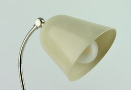 TISCHLEUCHTE MIT ZWEI GELENKEN, BAKELIT, SCHWEIZ UM 1930.