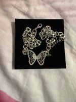 Collier papillon strass argenté 