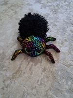Plueschspinne bunt schwarz Regenbogen mit grossen Augen
49