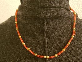 Kette orange goldf. ca. 48cm, o/Verschl. african style ?
