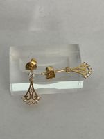 Raffiniertes Gold Ohrschmuck