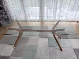 Grosser Glas-Esstisch mit skulpturalem Holzgestell