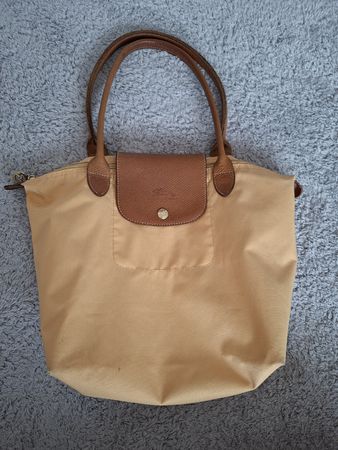 Sac à main Longchamp jaune avec traces d'usure visible