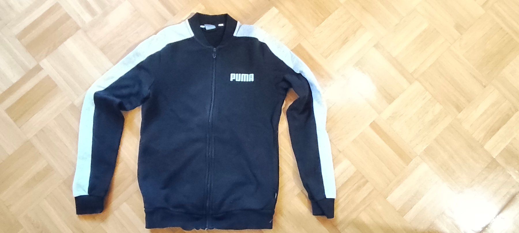 Puma Giacche & Cappotti: Trainerjacke Puma - 128, schwarz/grau – Usato da Oeschgen venduto da Minty