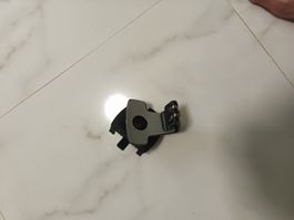 Handyhalter für Lüftungsgitter.