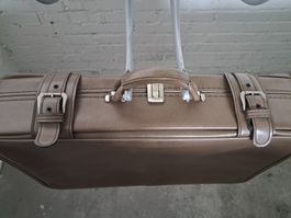 Valigia vintage marrone con fibbie in buono stato
