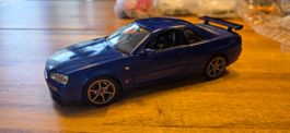 Modellauto Nissan Skyline R34 blau 1/24