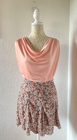 Pink cowl neck top with a flowy fit
