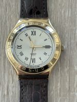 Montre Swatch vintage dorée bracelet cuir marron