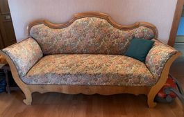 Canapé ancien en bois et tissu floral