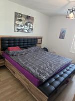 Doppelbett Massivholz mit Polsterkopfteil und Beleuchtung