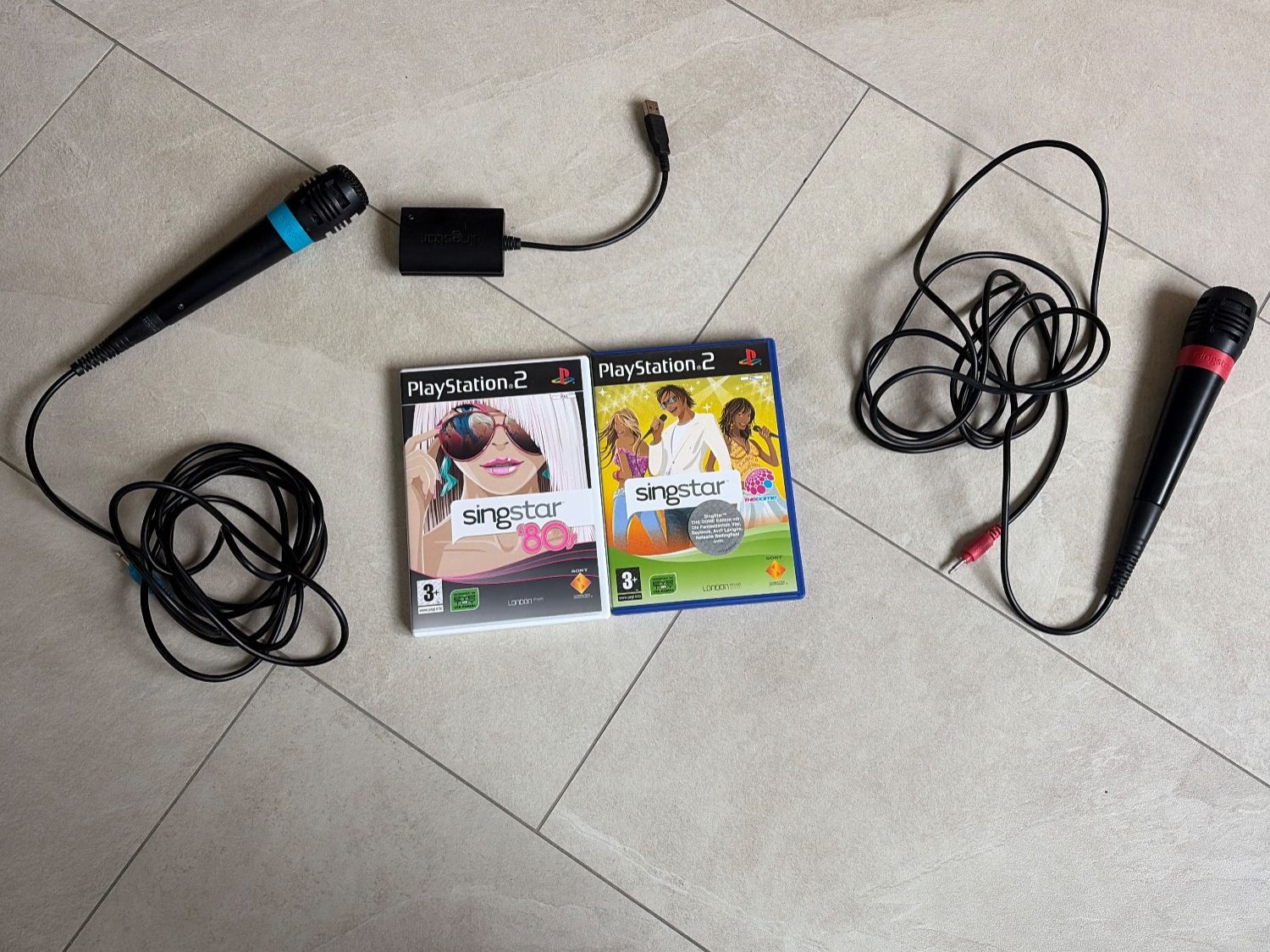 Microphones: SingStar PS2 Set mit 2 Original-Mikrofonen + USB-Adapter – D'occasion à Rüti ZH par Butterfly206cc 1