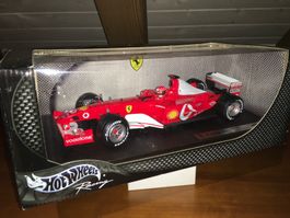 F1 Ferrari F2003-GA M. Schumacher 1/18 no Minichamps