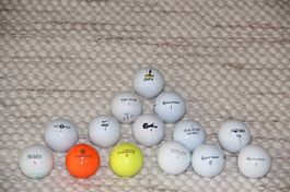 14 diverse Golfbälle