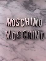 Authentic Moschino letter set, silver tone