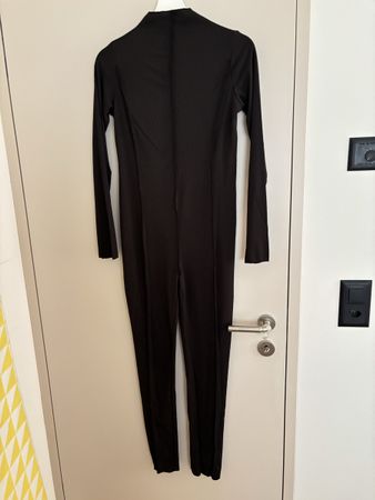 Schwarzer Rippstrick Jumpsuit, langarm, Grösse L