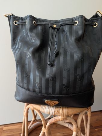 Original Maison Mollerus Beuteltasche schwarz/gold