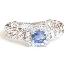 Juwelenring: 1 blauer Saphir 0.47 ct., 14 Diamanten, 1980.-