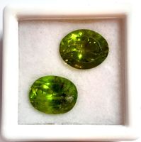 2x Péridots 7.51 ct - 11x9 mm - CERTIFICAT 612.- Fr