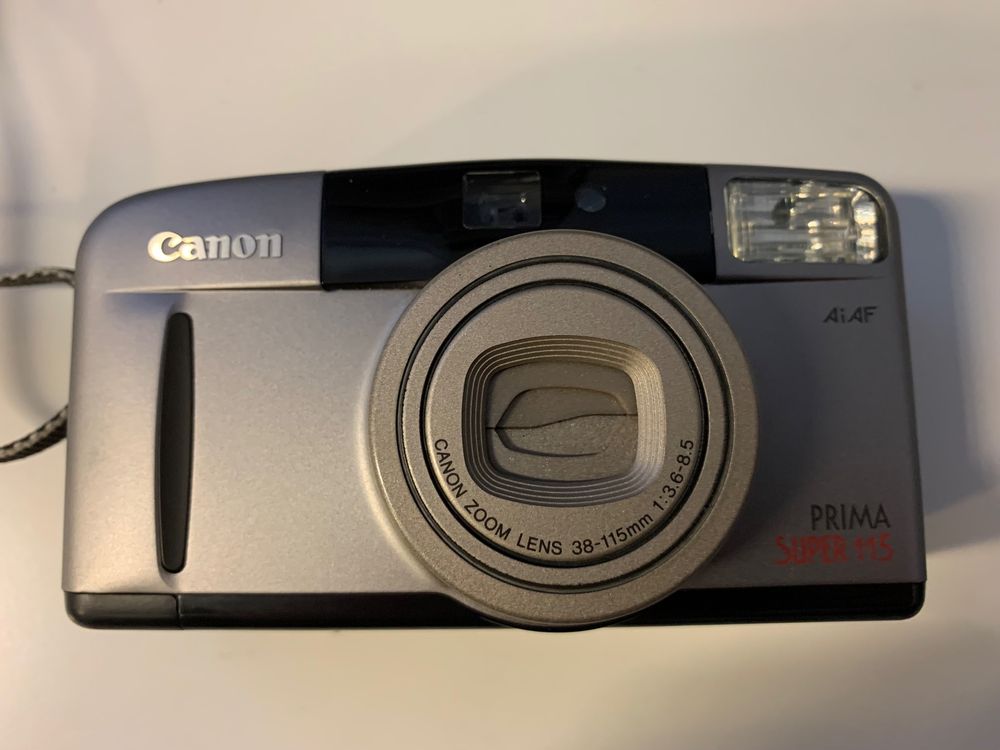 Appareil Photo Canon Prima Super 115 - Compact 35mm Argenté, Cache Pile Manquant