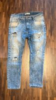 Jeans mit Kette