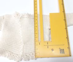 Gestrickte Puppenweste  - Gilet de poupée tricoté