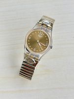 Swatch Damenuhr Goldfarben mit Steinbesatz