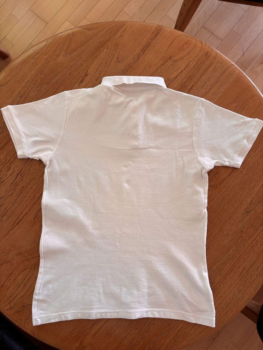 Primark Magliette Polo: Primark white polo shirt. – Usato da Zürich venduto da Grothschild 3
