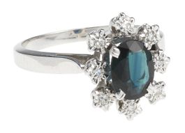 Bague or serti d’un saphir bleu-vert