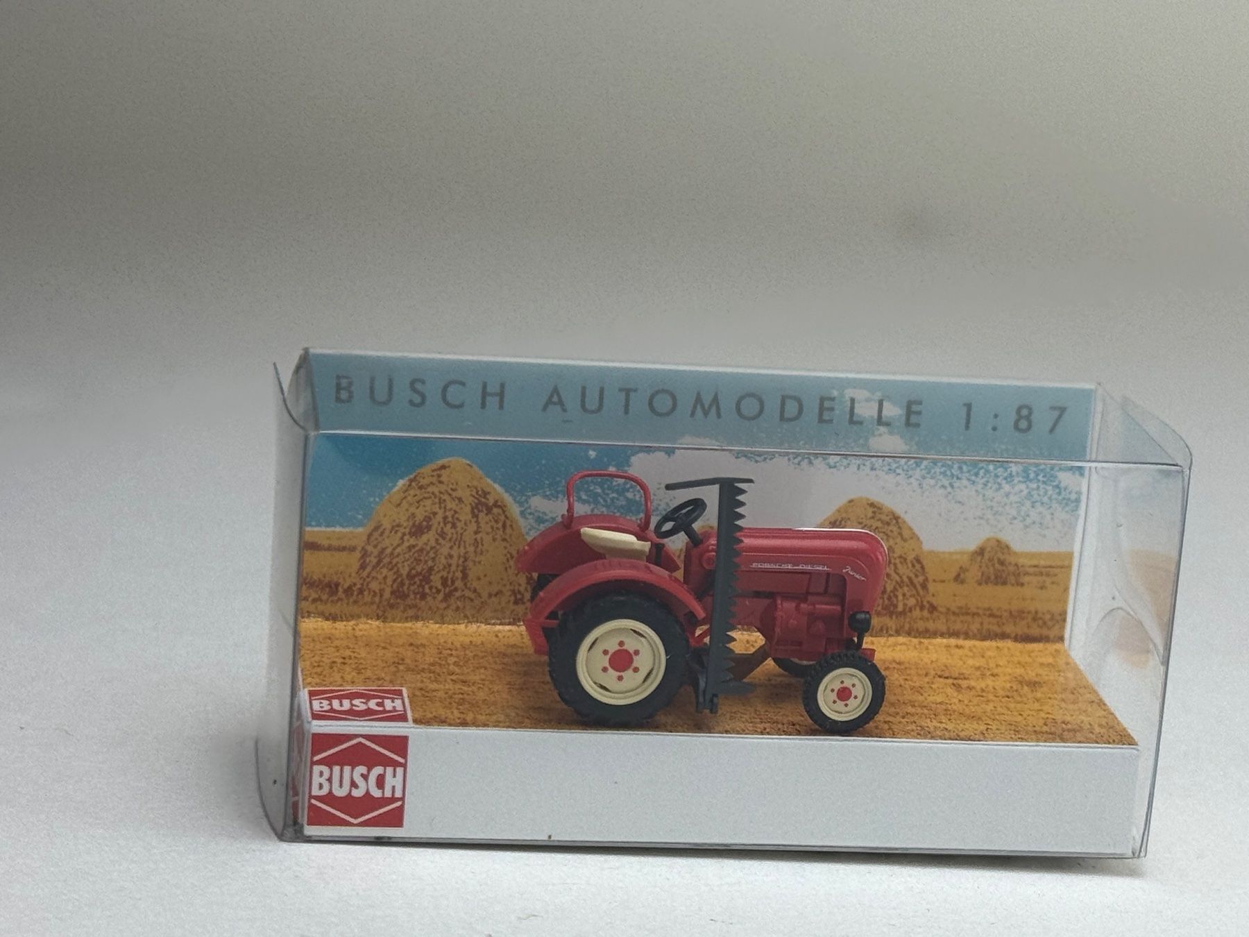 Busch Modellini d'auto: CH- Busch Porsche Schlepper mit Mähbalken – Usato da Elm venduto da Wikmtz