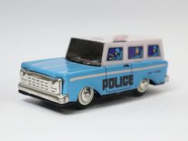 Blechauto Polizei Kombi Police Schwungradantrieb