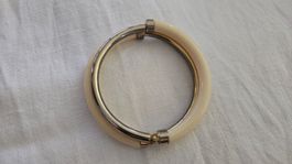 Bracciale rigido calamitato plastica e metallo