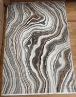 Wohnzimmerteppich abstrakt gemustert braun beige grau
