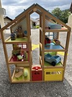 Maison de poupées en bois avec accessoires et figurines