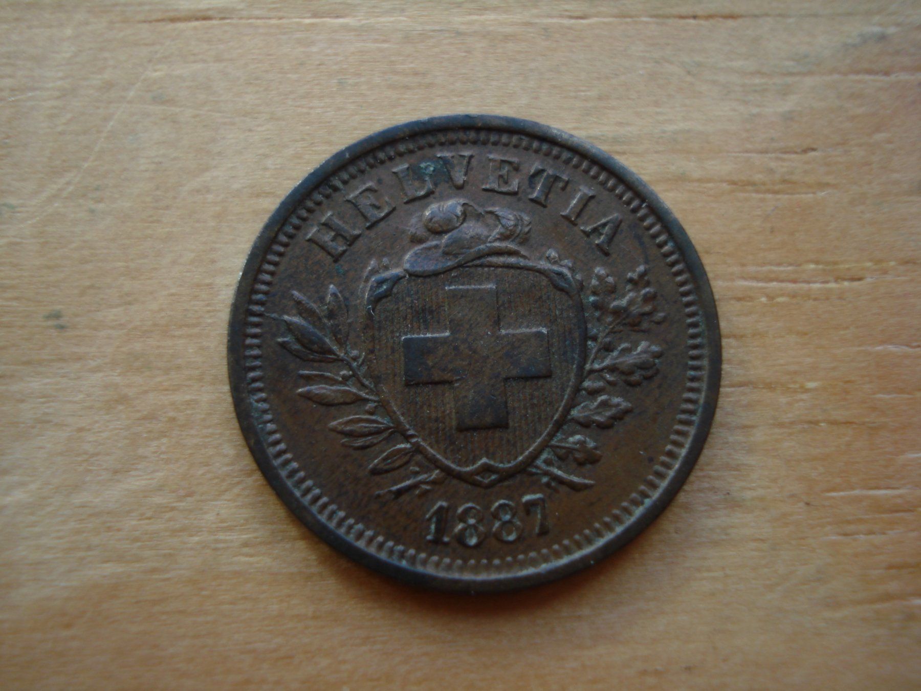 Alle Münzen: (Z2) 1 Rappen 1887 VZ – Gebraucht aus Erlach von Net-Coins