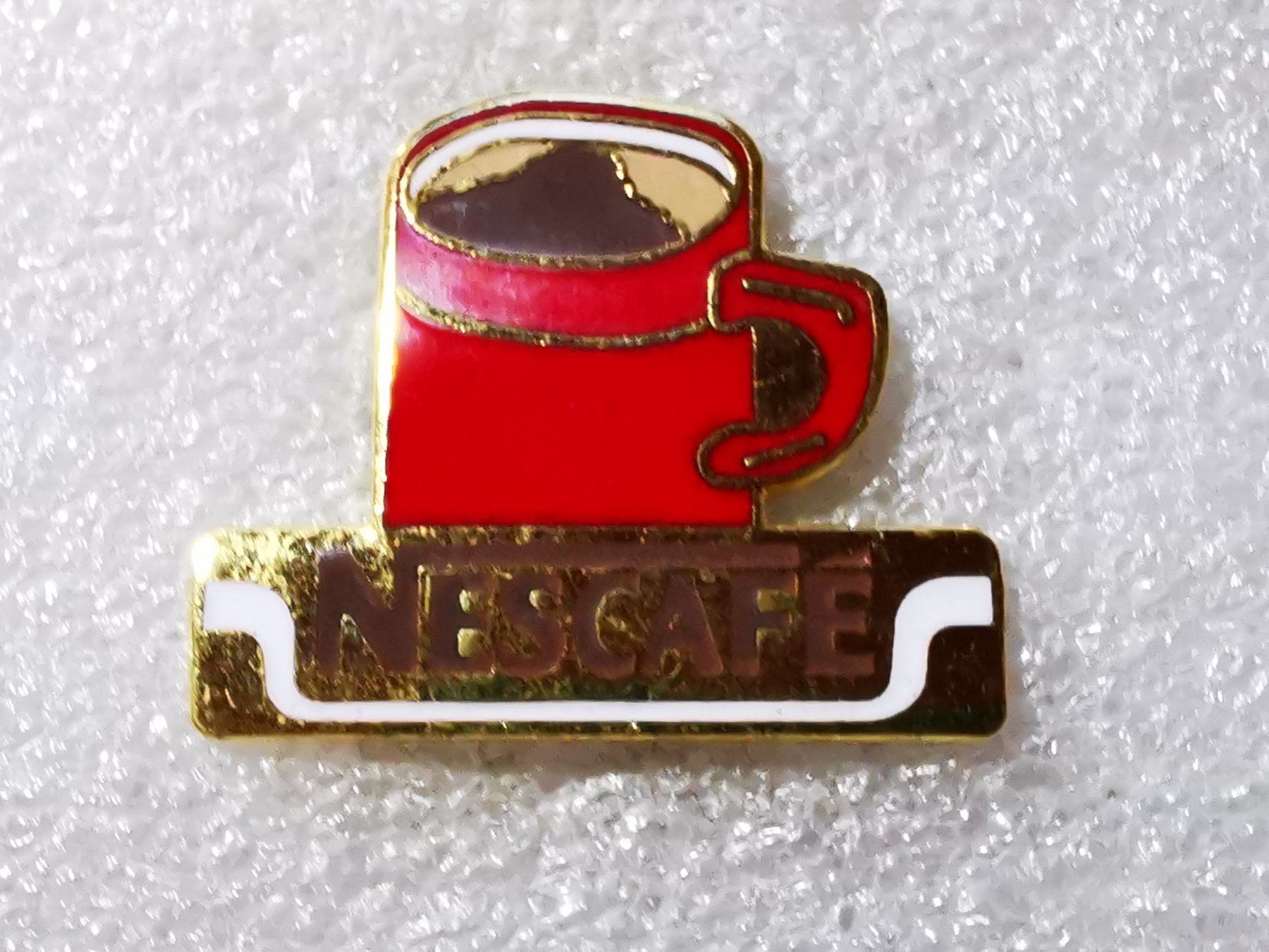 Placchette & Badge: Ansteckpin 49: Nescafe – Usato da Oppligen venduto da Pin-Fall-Shop