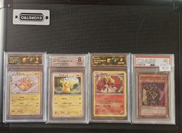 lotto carte gradate di Pokémon e Yu Gi Oh