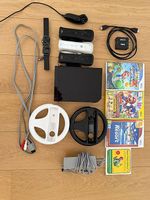 Nintendo Wii noire + 3 manettes + 4 jeux + volants