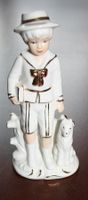 Porzellanfigur Junge mit Hund weiss-gold