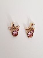 Hübsche goldige Ohrringe mit Rosa Steinen
