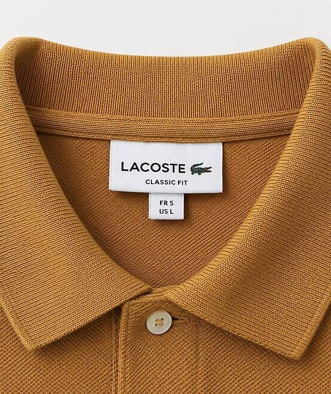 Lacoste Polos: Polo Lacoste camel taille L – D'occasion à Orbe par tom_q2vy 1