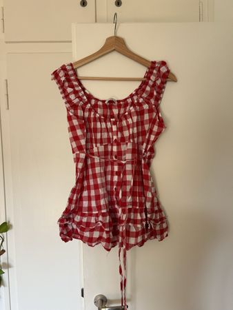 Red and white gingham babydoll top with ruffles and tie back
