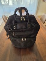 Wickelrucksack schwarz mit Zubehör in gutem Zustand