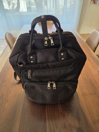 Wickelrucksack schwarz mit Zubehör in gutem Zustand