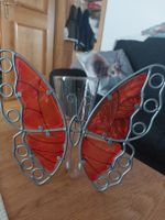 Schmetterling mit Blumenvase