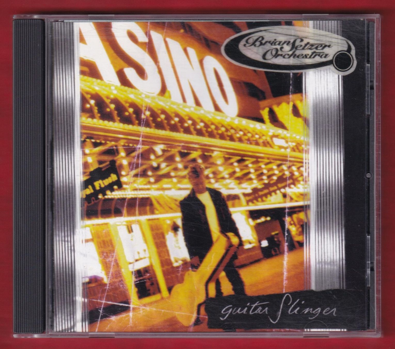 CDs: The Brian Setzer Orchestra - Guitar Slinger (CD) – Gebraucht aus Zürich von Pfluftl2000