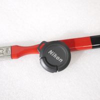 Nikon 28mm Coolpix Vordeckel / bouchon avant lentille.