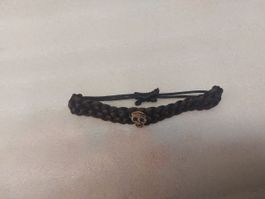 Adjustable braided bracelet – with a metal skull  - Frs 1