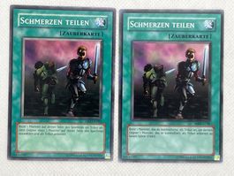 Schmerzen Teilen Zauberkarte, 2x Yu-Gi-Oh! Karten